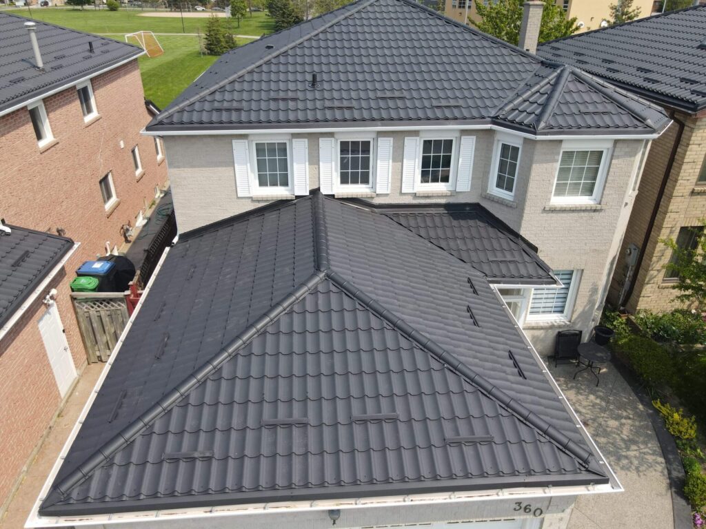 Grey metal tile roof on brick home Toronto metal roofing