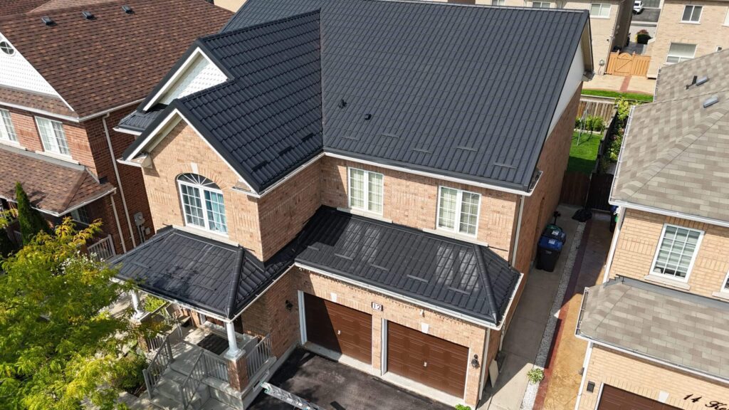 Drone view of a close-up aerial shot of dark metal tile roof