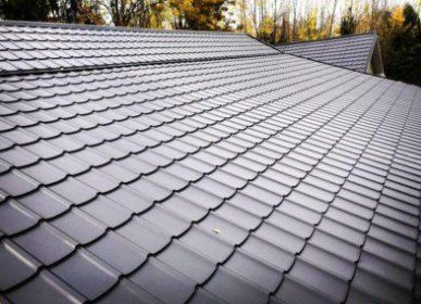 Dark grey metal tile roofing close-up Toronto roofing company