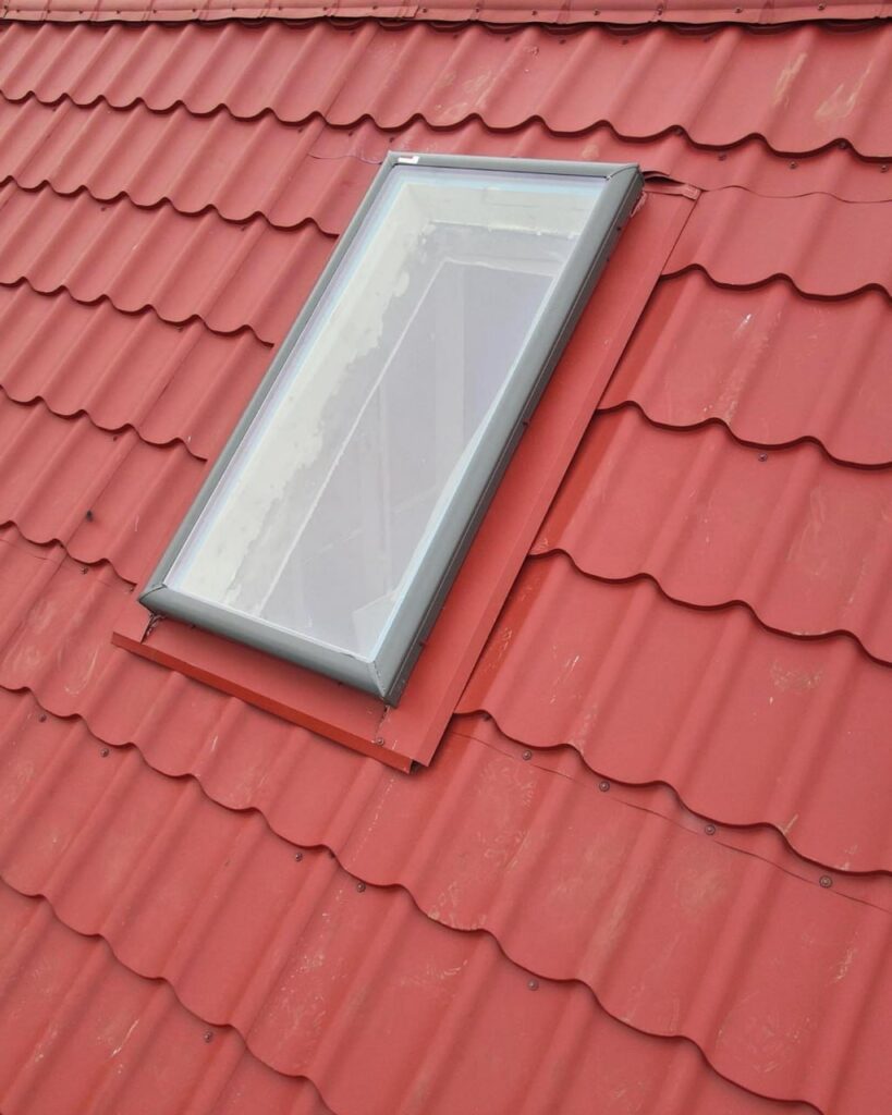 Skylight replacement with red metal tile roof installation
